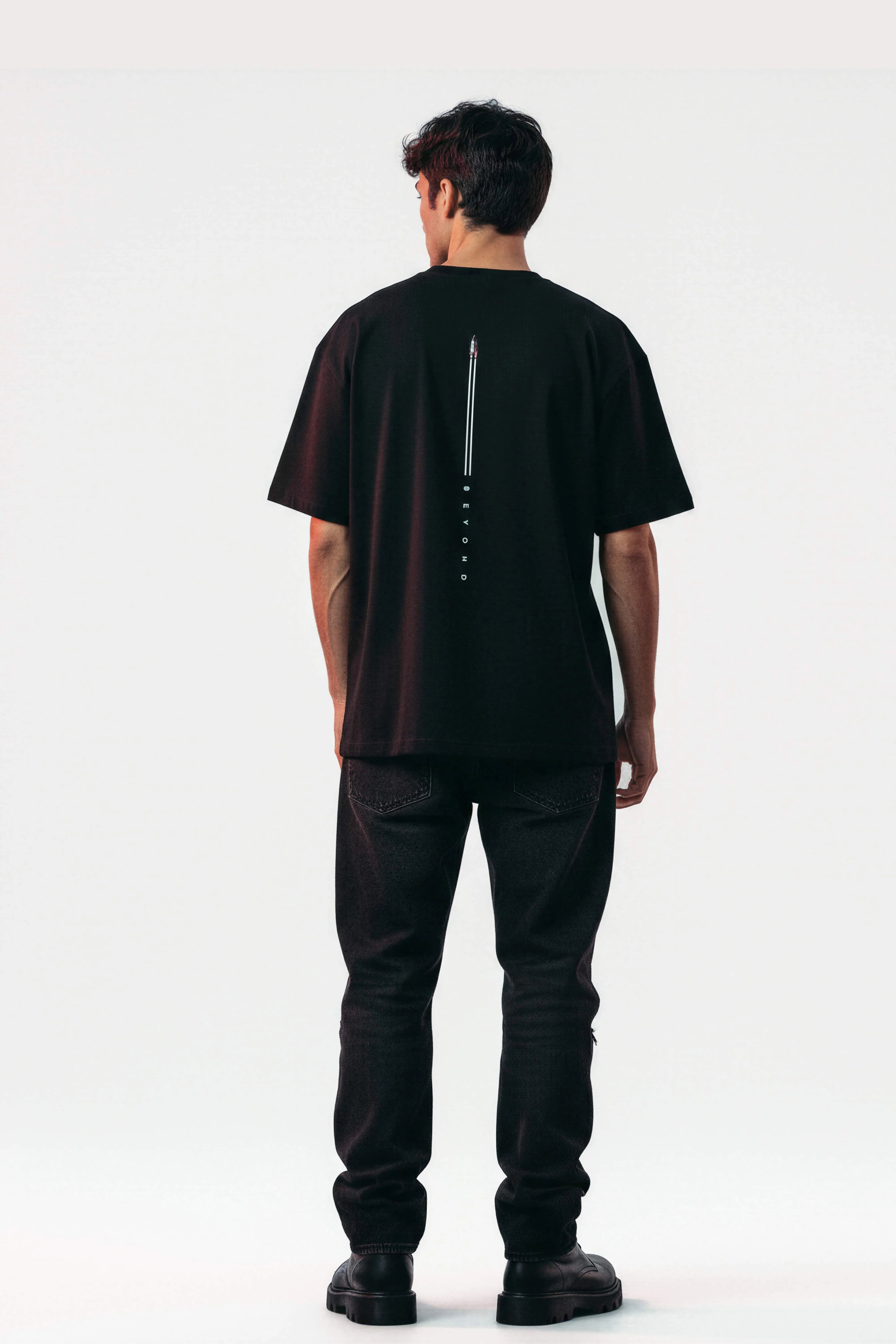 Men oversized black tshirt beyond folded