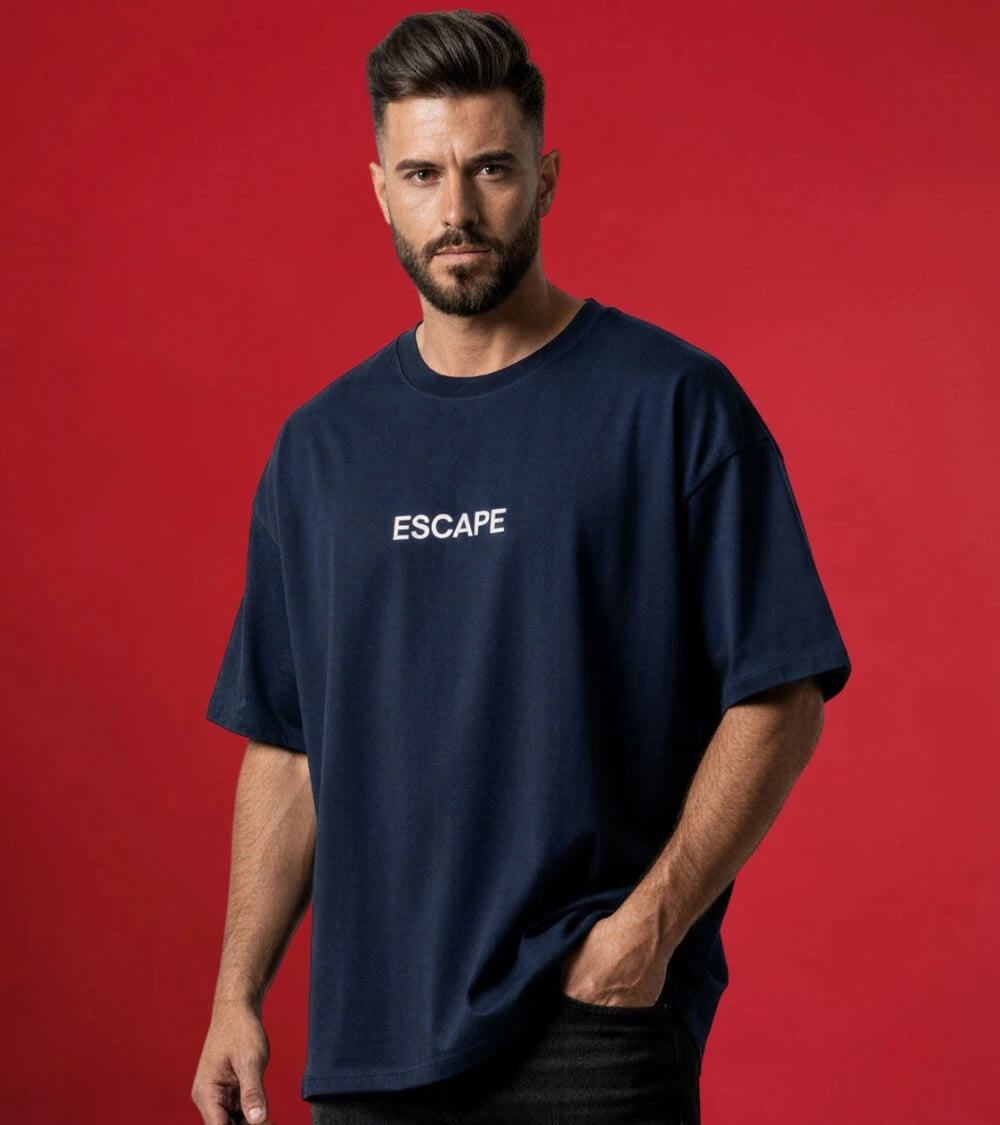 man wearing blue oversized escape t-shirt