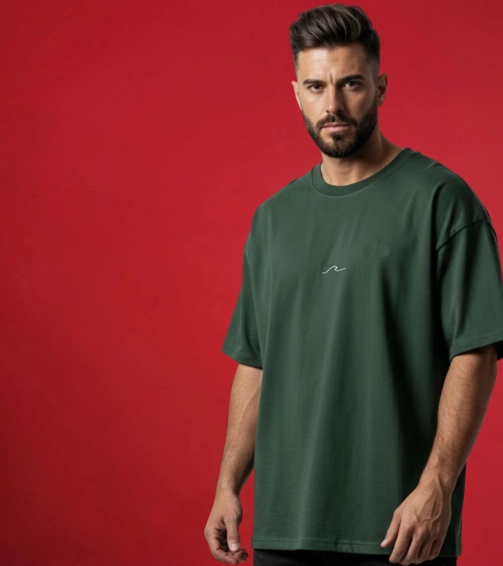 a man wearing green oversized t-shirt