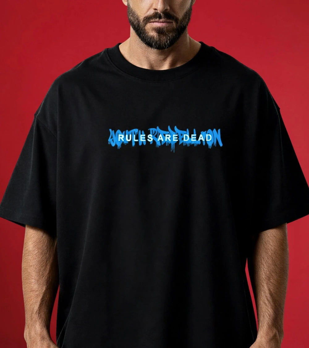 man wearing relaxed fit black t-shirt youth rebellion 